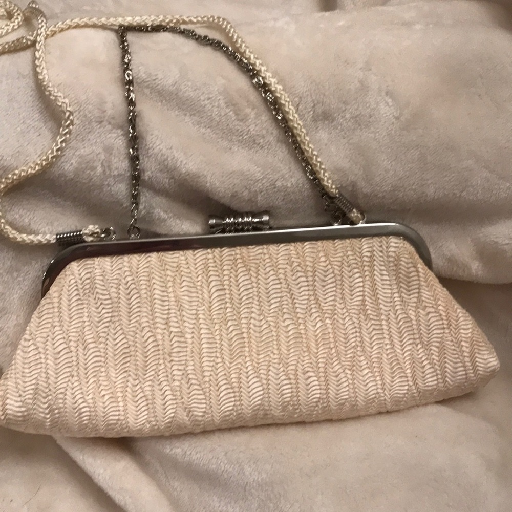Feminine cream clutch bag.
